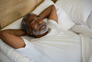 Man sleeping in a bed